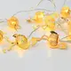 “METAL STRING LIGHTS (FLAMINGO)” 10 LED STRING LIGHTS WITH BATTERIES (2xΑΑ) WARM WHITE IP20 135+30cm TRANSPARENT CABLE